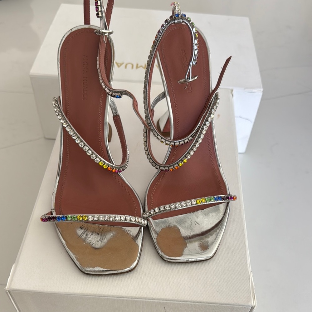 Amina Muaddi Silver Heels with Crystal Embellishments
All Crystal’s present